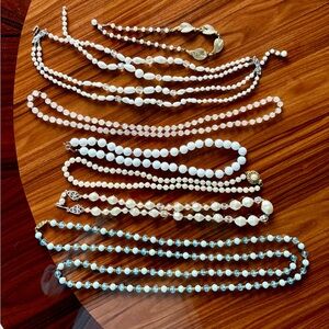 7 Vintage necklaces consisting of glass and plastic.